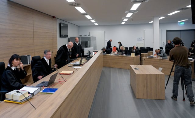 Defendants Jian G., a former assistant to then-member of the European Parliament Maximilian Krah, of the far-right Alternative for Germany (AFD) party, and Jaqi X. arrive at the courtroom for a high-profile espionage trial, in Dresden, Germany, August 5, 2025. REUTERS/Matthias Rietschel