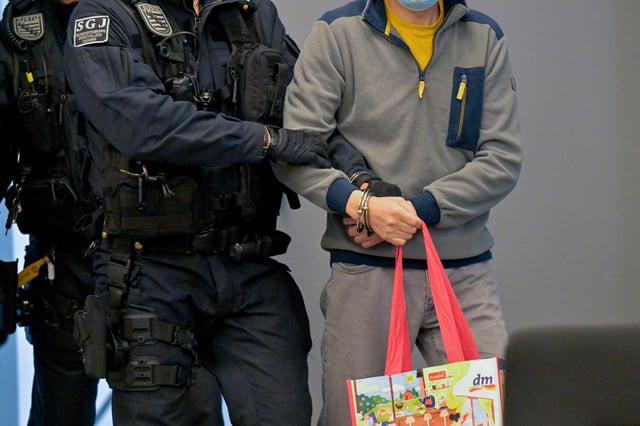 Defendant Jian G., a former assistant to then-member of the European Parliament Maximilian Krah, of the far-right Alternative for Germany (AFD) party, arrives at the courtroom for a high-profile espionage trial, in Dresden, Germany, August 5, 2025. REUTERS/Matthias Rietschel
