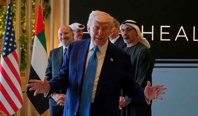 President Donald Trump attends a business meeting and roundtable at Qasr Al Watan, in Abu Dhabi, United Arab Emirates.Friday, May 16, 2025. At right is Crown Prince of Abu Dhabi Sheikh Khaled Bin Mohamed Bin Zayed Al Nahyan.(AP Photo/Altaf Qadri)