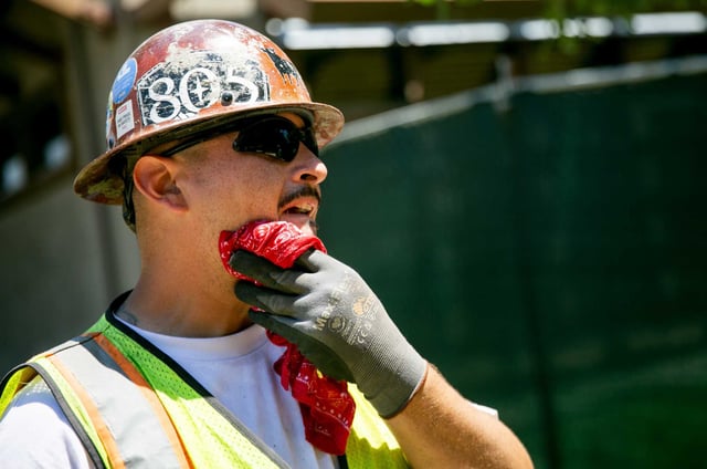 Richard Barajas wipes sweat off of his face in Santa Rosa in July 2024.