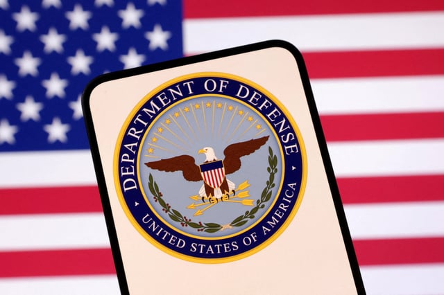 United States Department of Defense logo and U.S. flag are seen in this illustration taken April 23, 2025. REUTERS/Dado Ruvic/Illustration/File Photo