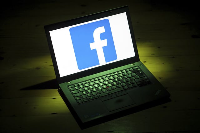 File photo of a Facebook logo on a laptop, taken in 2018.