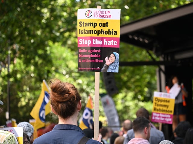 LONDON, UNITED KINGDOM - JULY 27: People gather to protest against discrimination, racism and Islamophobia as they march from Russel Square to Whitehall Street, which connects to Downing Street where the Prime Minister's Office Number 10 is located, in London, United Kingdom on July 27, 2024. Protesters chanted slogans. (Photo by Rasid Necati Aslim/Anadolu via Getty Images)