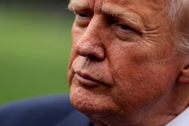 U.S. President Donald Trump speaks to reporters ahed of boarding Marine One to depart for New Jersey, at the White House in Washington, D.C., U.S., August 1, 2025. REUTERS/Jonathan Ernst