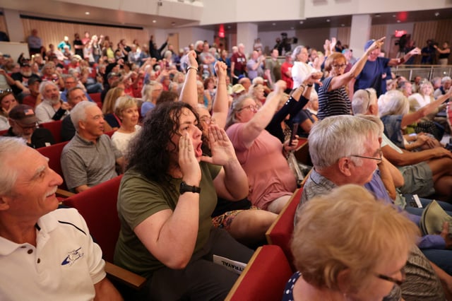 The crowd reacts as U.S. Representative Mike Flood (R-NE), answers questions from constituents during a town hall in Lincoln, Nebraska, U.S., August 4, 2025. REUTERS/Scott Morgan