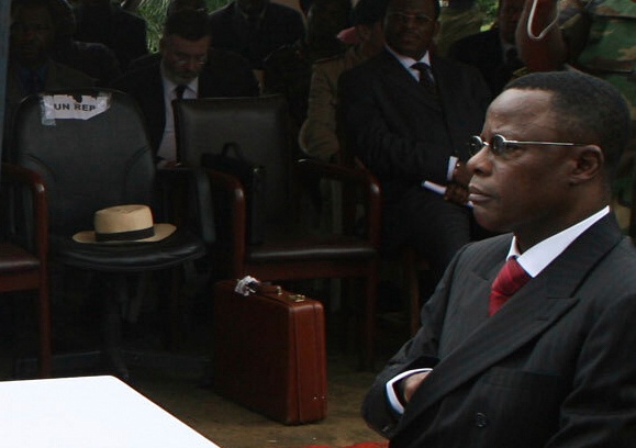 FILE - Cameroon Justice minister Maurice Kamto prepares to sign documents transferring the authority Bakassi peninsula to Cameroon in Archibong, Nigeria, Aug. 14, 2006. (AP Photo/George Osodi, File)