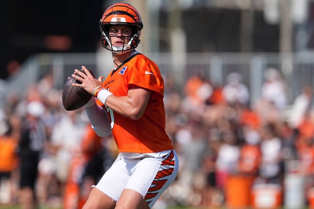 Jul 25, 2025; Cincinnati, OH, USA; Cincinnati Bengals quarterback Joe Burrow (9) looks to throw during training camp practice. Mandatory Credit: Kareem Elgazzar-Imagn Images/File Photo
