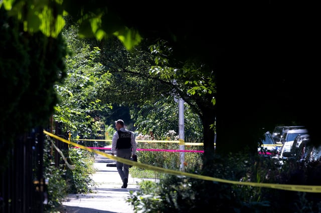 Police investigate the scene of a drive-by shooting in Chicago on July 6, 2024.