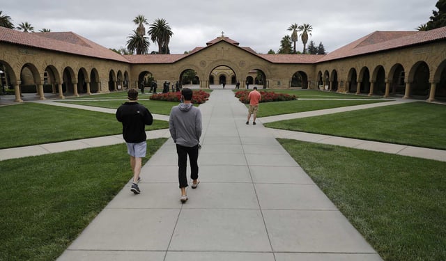 Stanford University will permanently lay off hundreds of employees this fall as part of sweeping budget reductions driven by shifting federal policies and financial pressures, according to state filings and statements from university officials.