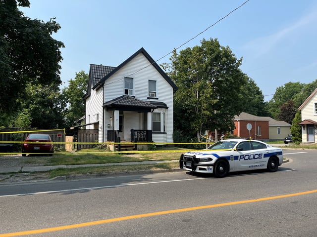 Police block of the scene after a fight saw one person die and two others injured.