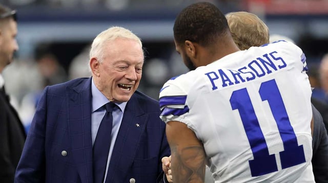 Jan 16, 2022; Arlington, Texas, USA; Dallas Cowboys owner Jerry Jones meets with outside linebacker Micah Parsons (11) prior to the NFC Wild Card playoff football game against the San Francisco 49ers at AT&amp;T Stadium. Mandatory Credit: Kevin Jairaj-Imagn Images