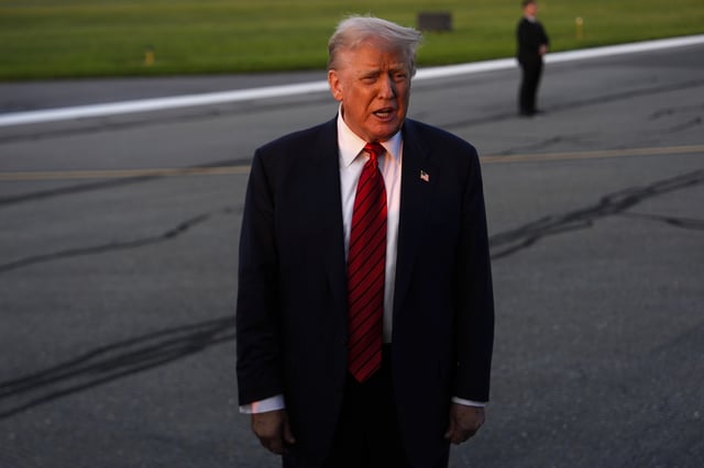President Donald Trump speaks with reporters before boarding Air Force One at Lehigh Valley International Airport, Sunday, Aug. 3, 2025, in Allentown, Pa. (AP Photo/Julia Demaree Nikhinson)
