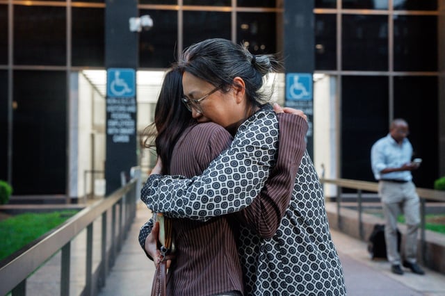 Yeonsoo Go, a Purdue student who was detained by immigration authorities in Manhattan last week, embraces her mother after being released from immigration custody, Monday, Aug. 4, 2025, in New York. (AP Photo/Olga Fedorova)