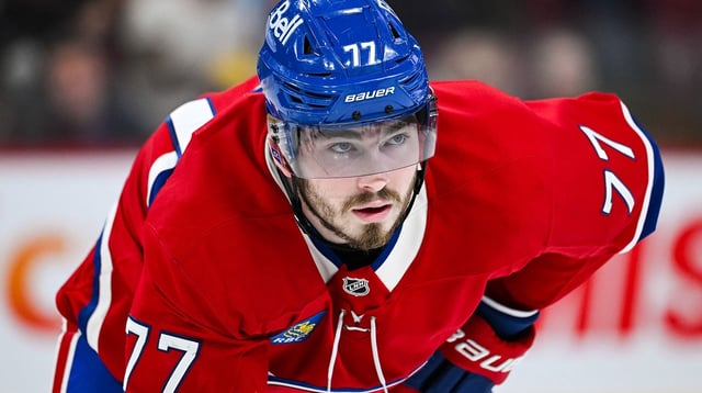 Feb 8, 2025; Montreal, Quebec, CAN; Montreal Canadiens center Kirby Dach (77) waits for a face-off against the New Jersey Devils during the second period at Bell Centre. Mandatory Credit: David Kirouac-Imagn Images