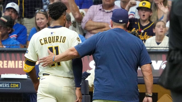 Jul 29, 2025; Milwaukee, Wisconsin, USA; Milwaukee Brewers manager Pat Murphy (49) gives outfielder Jackson Chourio (11) a pat on the back after coming out of the game because of an injury against the Chicago Cubs in the fifth inning at American Family Field. Mandatory Credit: Michael McLoone-Imagn Images