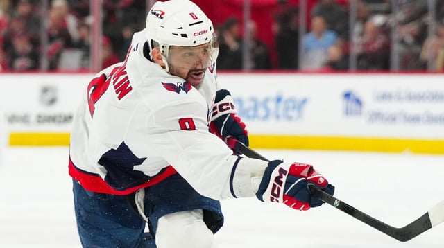 May 10, 2025; Raleigh, North Carolina, USA; Washington Capitals left wing Alex Ovechkin (8) takes a shot against the Carolina Hurricanes during the second period in game three of the second round of the 2025 Stanley Cup Playoffs at Lenovo Center. Mandatory Credit: James Guillory-Imagn Images