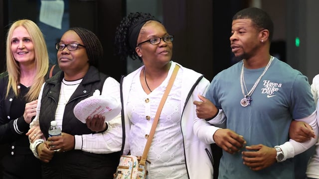 Laterria Smith, second from left, and Chris Perkins, right, walk out of the Leighton Criminal Court Building in Chicago alongside family and friends following a guilty verdict in the murder trial of Crosetti Brand on June 5, 2025.  Brand was found guilty of killing Smith’s son Jayden Perkins, 11, who was trying to protect his mother from Brand’s knife attack on Smith. (Chris Sweda/Chicago Tribune)