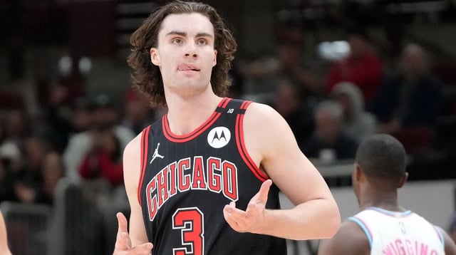 Apr 9, 2025; Chicago, Illinois, USA; Chicago Bulls guard Josh Giddey (3) reacts after making a three point basket against the Miami Heat during the second half at United Center. Mandatory Credit: David Banks-Imagn Images