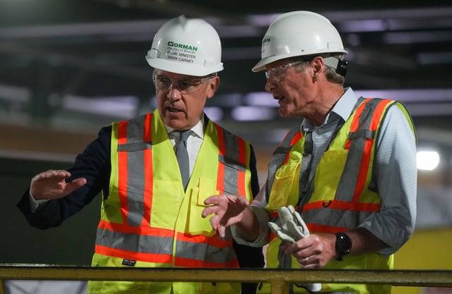 Prime Minister Mark Carney is given a tour of the Gorman Brothers Lumber sawmill by Gorman Group CEO Nick Arkle, right, in West Kelowna, B.C. on Tuesday, August 5, 2025. THE CANADIAN PRESS/Darryl Dyck