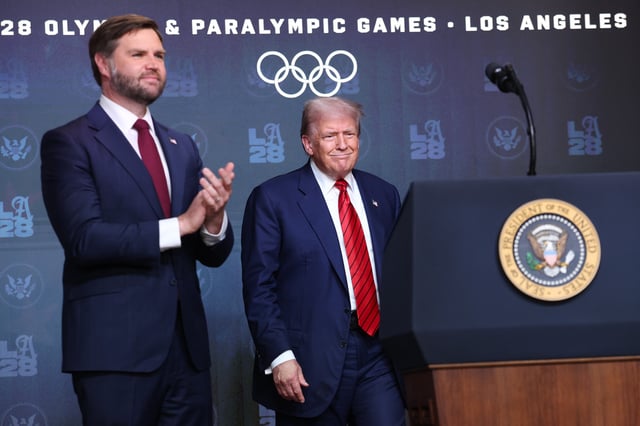 President Donald Trump can be seen arriving to speak as U.S. Vice President JD Vance (L) looks on before signing an executive order in the South Court Auditorium in the Eisenhower Executive Office Building on August 5, 2025, in Washington, D.C. (Photo by Win McNamee/Getty Images)