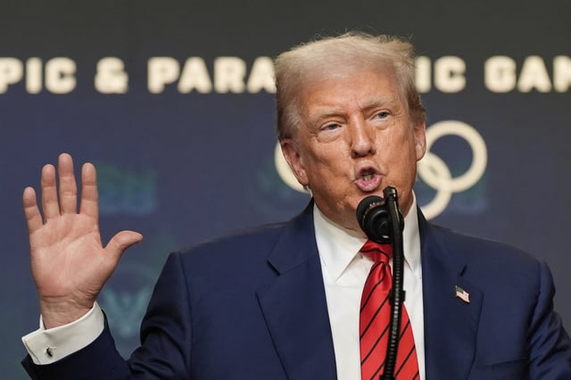 President Donald Trump answers questions from reporters after signing an executive order about the 2028 Los Angeles Olympic Games, in the South Court Auditorium of the Eisenhower Executive Office Building on the White House campus, Tuesday, Aug. 5, 2025, in Washington.