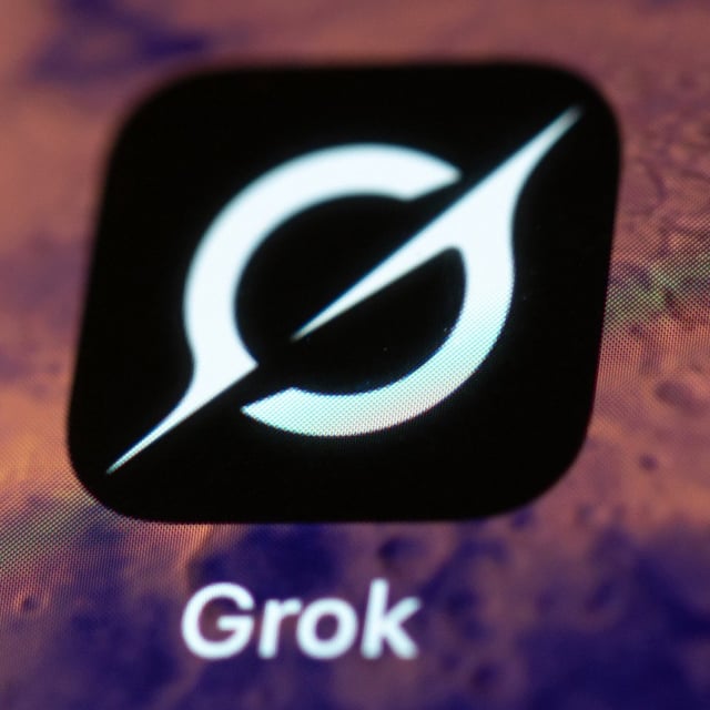 The Grok app on a smartphone with a mars wallpaper