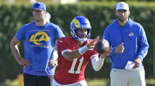 Jul 29, 2024; Los Angeles, CA, USA; Los Angeles Rams quarterback Matthew Stafford (9) and quarterbacks coach Dave Ragone look on as quarterback Jimmy Garoppolo (11) participates in drills during training camp at Loyola Marymount University. Mandatory Credit: Jayne Kamin-Oncea-Imagn Images