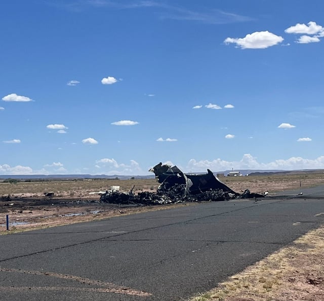 The remains of the medical transport plane are seen near Chinle Airport on Tuesday.