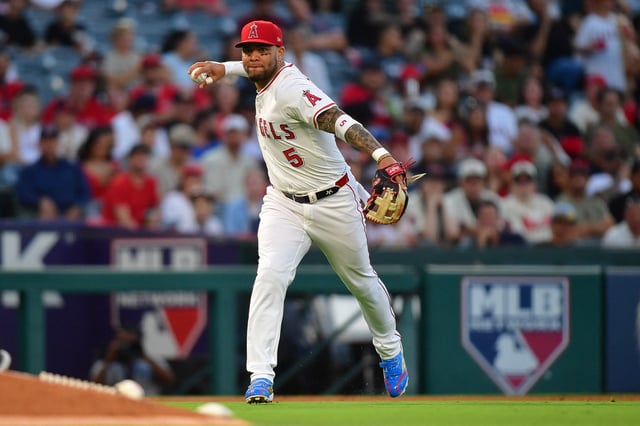 Aug 1, 2025; Anaheim, California, USA; Los Angeles Angels third baseman Yoan Moncada (5) throws to first for the out against Chicago White Sox shortstop Colson Montgomery (12) during the fourth inning at Angel Stadium. Mandatory Credit: Gary A. Vasquez-Imagn Images