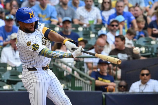 Jul 27, 2025; Milwaukee, Wisconsin, USA; Milwaukee Brewers center fielder Jackson Chourio (11) hits a double to drive in a run in the third inning against the Miami Marlins at American Family Field. Mandatory Credit: Benny Sieu-Imagn Images/File Photo