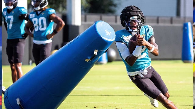 Jacksonville Jaguars wide receiver Travis Hunter (12) rounds a tackling dummy after hauling in a pass during an NFL training camp session ten at the Miller Electric Center, Tuesday, Aug. 5, 2025, in Jacksonville, Fla. Mandatory Credit: Doug Engle/Florida Times-Union