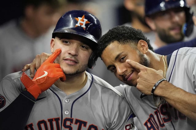 Houston Astros&#39; Yainer Diaz, left, celebrates with Jeremy Pena after hitting a three-run homer in the fifth inning of a baseball game against the Miami Marlins, Tuesday, Aug. 5, 2025, in Miami. (AP Photo/Rebecca Blackwell)
