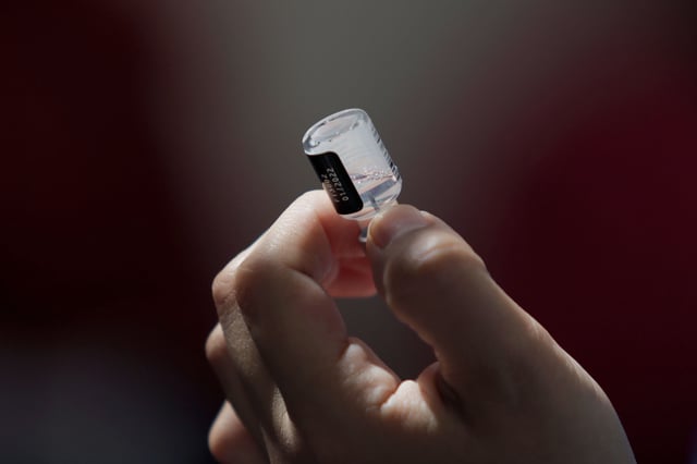 Medical staff prepare syringes before vaccinating a group of children under 11 years of age against COVID-19 with the Pfizer-BioNTech biologic inside the Centro de Salud T-III Dr. Juan Duque de Estrada in Mexico City. (Photo by Gerardo Vieyra/NurPhoto via AP)