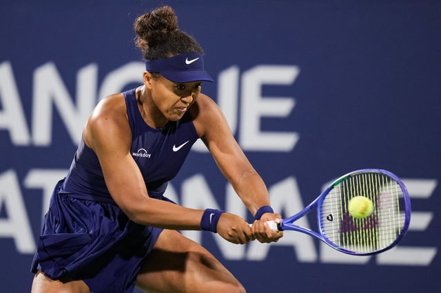 Aug 5, 2025; Montreal, QC, Canada; Naomi Osaka (JPN) returns the ball to Elina Svitolina (UKR) in quarterfinal play at IGA Stadium. Mandatory Credit: David Kirouac-Imagn Images