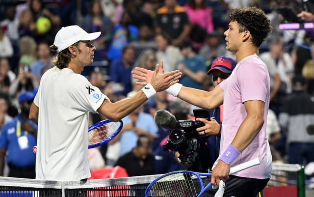 Aug 5, 2025; Toronto, ON, Canada;  Ben Shelton (USA, right) shakes hands after defeating Alex De Minaur (AUS) during quarterfinal play at Sobeys Stadium. Mandatory Credit: Dan Hamilton-Imagn Images