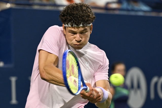 Aug 5, 2025; Toronto, ON, Canada;  Ben Shelton (USA) plays a shot against Alex De Minaur (AUS) during quarterfinal play at Sobeys Stadium. Mandatory Credit: Dan Hamilton-Imagn Images