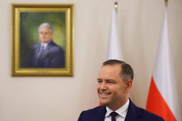President-elect Karol Nawrocki smiles as he meets Poland's outgoing President Andrzej Duda (not pictured) at the Presidential Palace in Warsaw, Poland, June 3, 2025. REUTERS/Kacper Pempel/File Photo