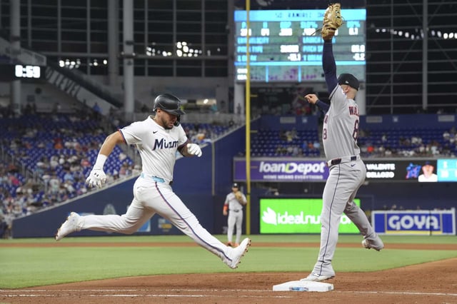 Houston Astros first baseman Christian Walker (8) makes the catch to get out Miami Marlins&#39; Agustin Ramirez in the eigth inning of a baseball game, Tuesday, Aug. 5, 2025, in Miami. (AP Photo/Rebecca Blackwell)