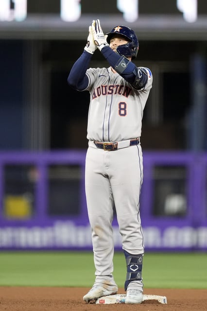 Houston Astros&#39; Christian Walker celebrates on second base after hitting a double in the fifth inning of a baseball game against the Miami Marlins, Tuesday, Aug. 5, 2025, in Miami. (AP Photo/Rebecca Blackwell)