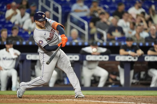 Houston Astros&#39; Yainer Diaz hits a three-run homer in the fifth inning of a baseball game against the Miami Marlins, Tuesday, Aug. 5, 2025, in Miami. (AP Photo/Rebecca Blackwell)