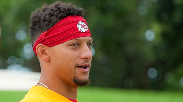 Jul 22, 2025; St. Joseph, MO, USA; Kansas City Chiefs quarterback Patrick Mahomes (15) walks down the hill to the practice fields during training camp at Missouri Western State University. Mandatory Credit: Denny Medley-Imagn Images