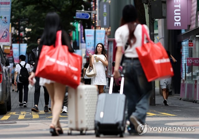 This file photo shows a street in the popular tourist district of Myeongdong, in central Seoul, on June 26, 2025. (Yonhap)