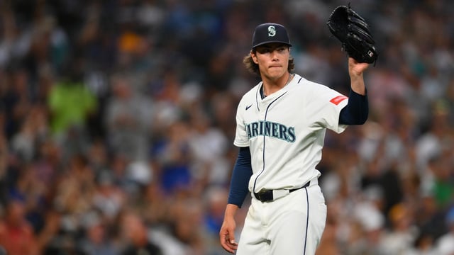 Aug 5, 2025; Seattle, Washington, USA; Seattle Mariners starting pitcher Bryan Woo (22) reacts to the final out against the Chicago White Sox during the seventh inning at T-Mobile Park. Mandatory Credit: Steven Bisig-Imagn Images