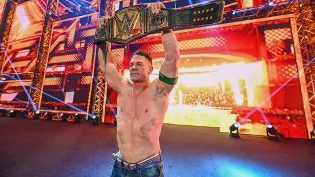 John Cena celebrates with the WWE Undisputed Championship after defeating CM Punk in the Night of Champions | Image: wwe.com