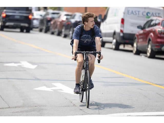  A cyclist pedals through the intersection of Morris Street and Hollis Street on Tuesday.