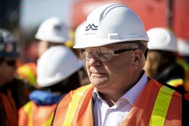 Ontario Premier Doug Ford talks to workers as he visits the starting site of the Metrolinx subway extension project in Scarborough, Ont., on April 29, 2022.