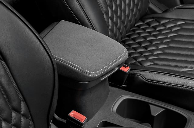 Front arm rest finished in black fabric upholstery.