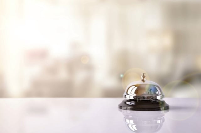 hotel front desk with service bell stock
