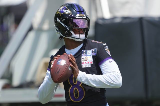 Jul 23, 2025; Owings Mills, MD, USA; Baltimore Ravens quarterback Lamar Jackson (8) warms up during training camp at Under Armour Performance Center. Mandatory Credit: Mitch Stringer-Imagn Images