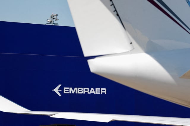 A logo of Embraer is seen at the 55th International Paris Airshow at Le Bourget Airport near Paris, France, June 17, 2025. REUTERS/Benoit Tessier/File Photo